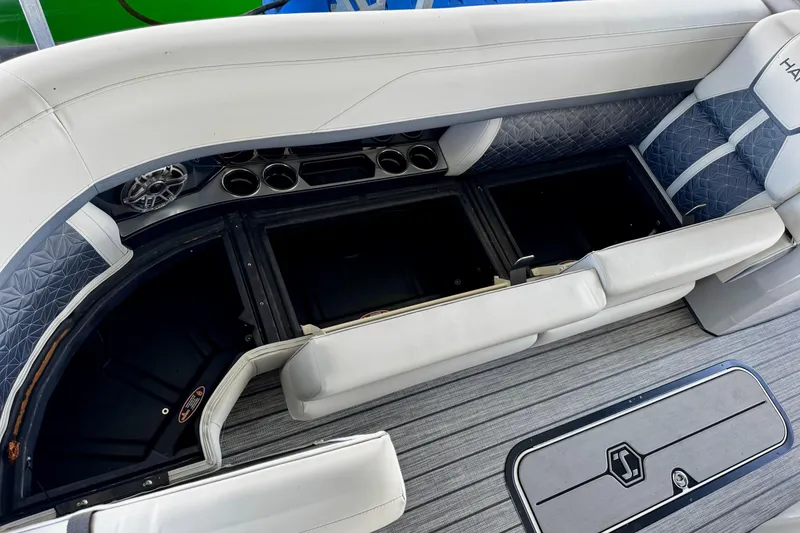 Slide: The Image of Interior view of 2026 Harris Grand Mariner 250 SLDH boat with seating and storage compartments. - 11