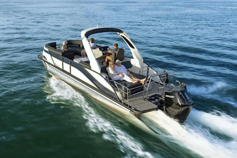 Slide: The Image of Manufacturer Provided Image: Manufacturer Provided Image: 2025 Harris Grand Mariner 250 cruising on open water with passengers enjoying the ride. - 2