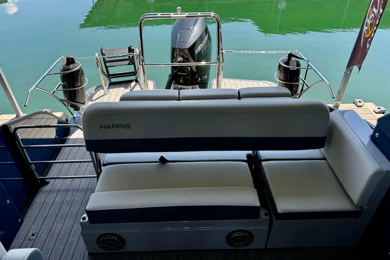 Slide: The Image of 2026 Harris Grand Mariner 250 SLDH pontoon boat with luxurious seating and outboard motor. - 15