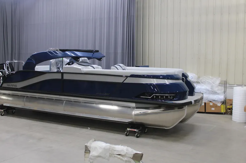 The Image of 2026 Harris Grand Mariner 250 SLDH pontoon boat in a showroom setting. - 0