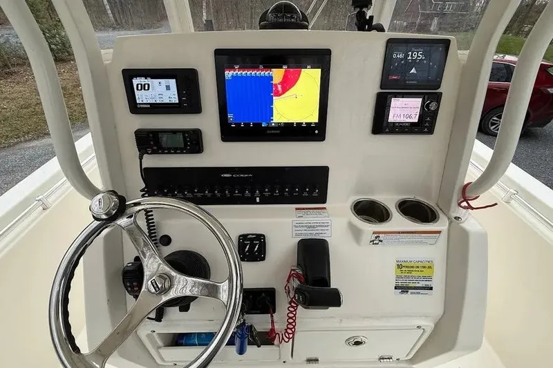 Slide: The Image of 2020 Cobia 240 Center Console dashboard with navigation and control systems. - 20