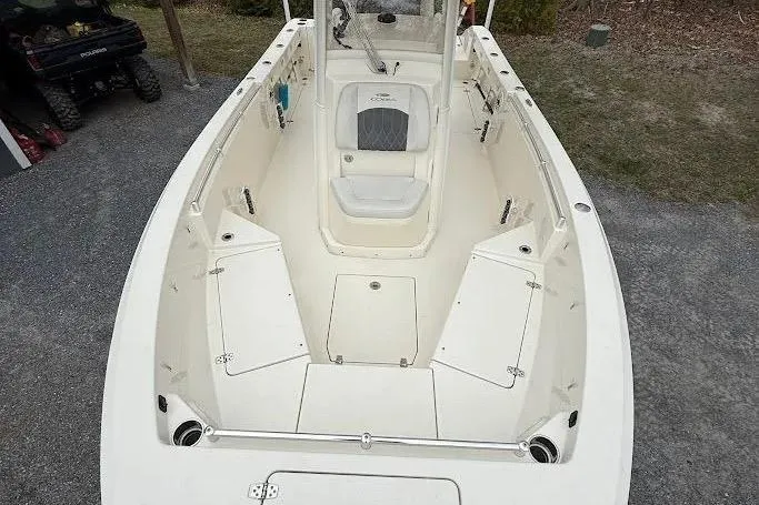 Slide: The Image of 2020 Cobia 240 Center Console boat with spacious deck and seating. - 21