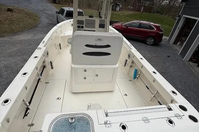 Slide: The Image of 2020 Cobia 240 Center Console boat with spacious deck and modern controls. - 22