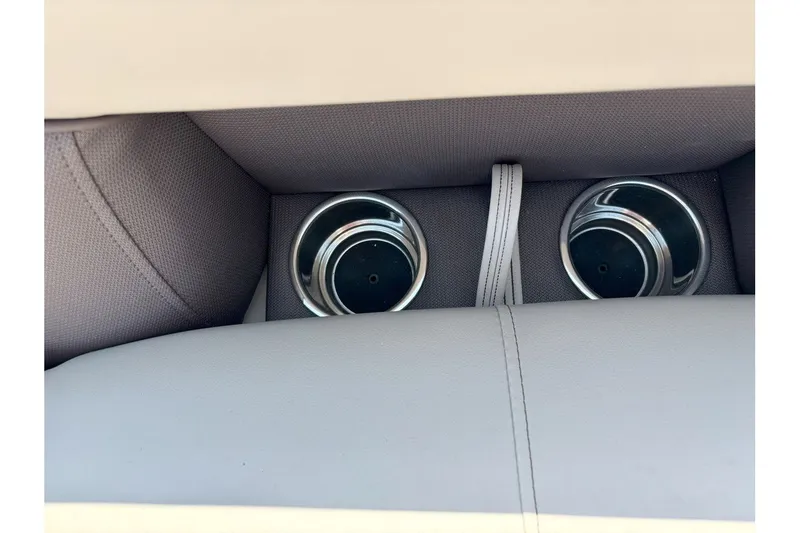 Slide: The Image of Close-up of two stainless steel cup holders in a cushioned area. - 20