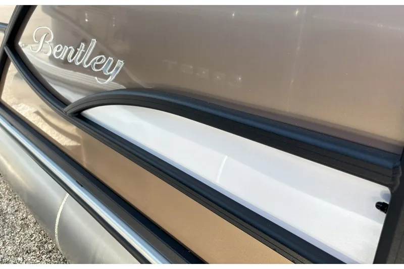 Slide: The Image of Close-up of a Bentley Pontoons FISH 200 CW with sleek lines and a glossy finish. - 24