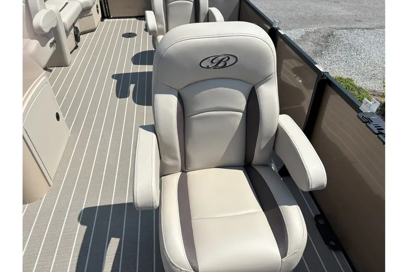 Slide: The Image of A luxurious seat on a Bentley pontoon boat with striped flooring. - 16
