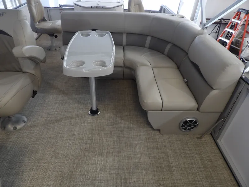 Slide: The Image of Interior of a 2022 SilverWave 2410 RLP SW3 with beige L-shaped sofa and table. - 7