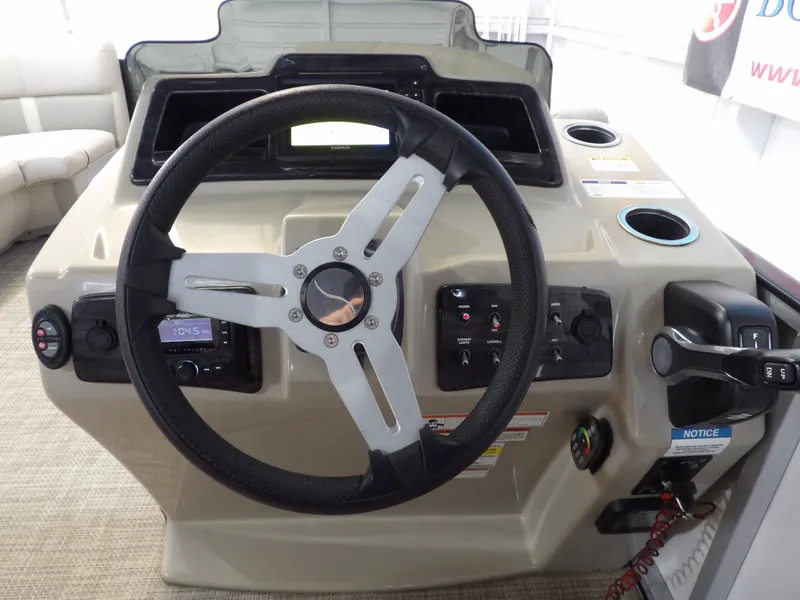 Slide: The Image of The image shows the helm of a 2022 SilverWave 2410 RLP SW3 with a steering wheel and controls. - 14