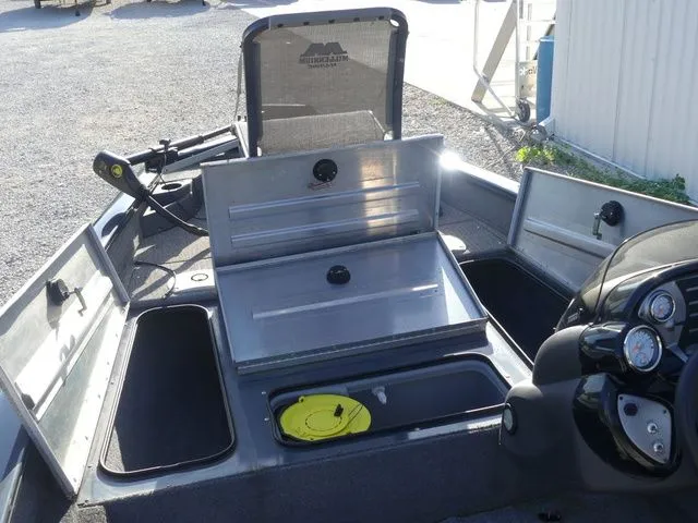 Slide: The Image of The image shows the deck of a Tracker Pro Team 175 TF boat with multiple storage compartments. - 28