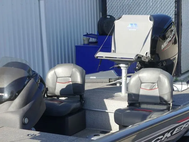 Slide: The Image of The image shows a 2022 Tracker Pro Team 175 TF boat with gray seats and a Mercury engine. - 23