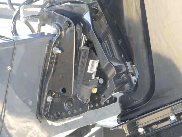 Slide: The Image of Close-up of a boat's outboard motor with visible mechanical components. - 14
