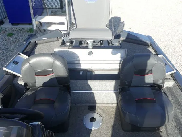 Slide: The Image of The image shows the interior of a Tracker Pro Team 175 TF boat with two seats. - 30