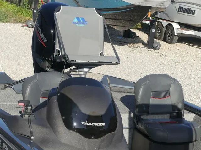 Slide: The Image of The image shows a Tracker Pro Team 175 TF boat with a Mercury engine. - 22