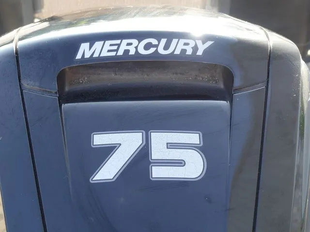 Slide: The Image of Close-up of a Mercury 75 outboard motor. - 13