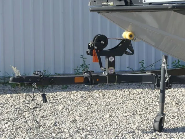 Slide: The Image of Close-up of a Tracker Pro Team 175 TF boat trailer on gravel. - 19