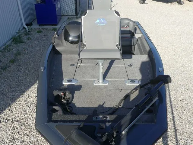 Slide: The Image of A gray fishing boat with an elevated seat and a motor at the rear. - 21