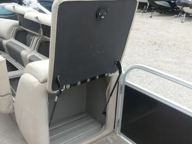 Slide: The Image of An open storage compartment on a 2020 Sun Tracker Party Barge 22 DLX. - 36