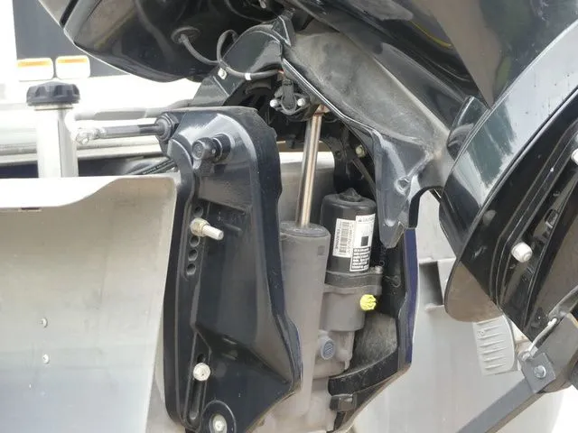 Slide: The Image of Close-up of a boat's outboard motor with visible mechanical parts. - 16