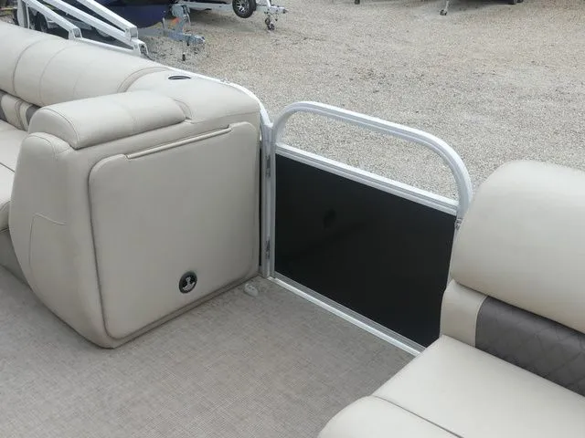 Slide: The Image of Interior view of a 2020 Sun Tracker Party Barge 22 DLX with beige seating. - 22