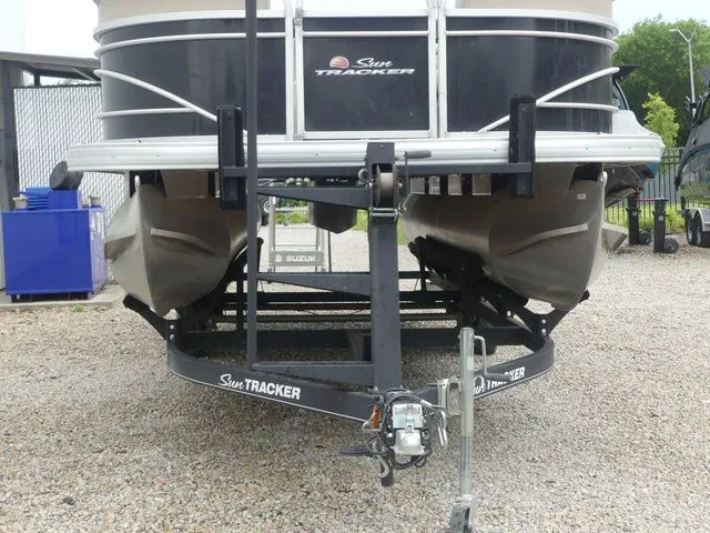 Slide: The Image of A 2020 Sun Tracker Party Barge 22 DLX on a trailer. - 12