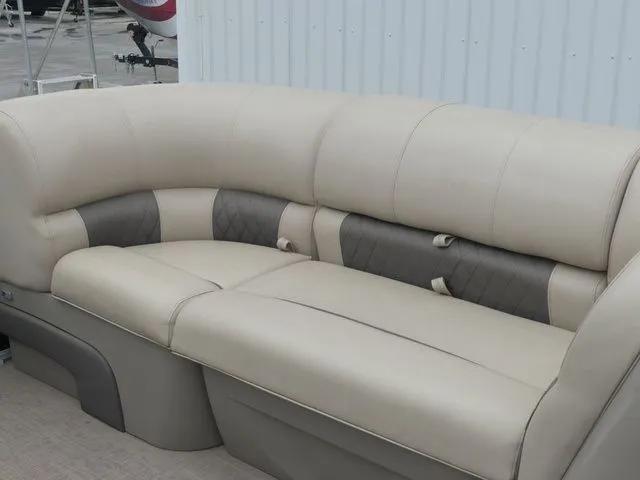 Slide: The Image of Beige seating on a boat with gray accents, set against a white wall. - 32