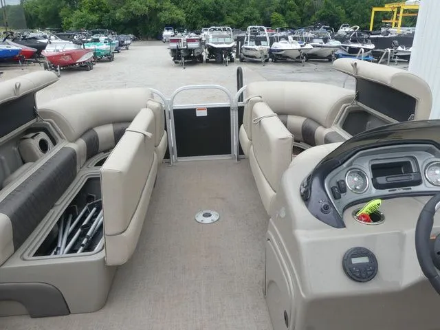 Slide: The Image of Interior of a Sun Tracker Party Barge 22 DLX pontoon boat with seating and helm console. - 33