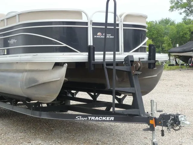 Slide: The Image of A 2020 Sun Tracker Party Barge 22 DLX on a trailer, ready for transport. - 11