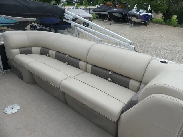 Slide: The Image of A spacious, cushioned seating area on a Sun Tracker Party Barge 22 DLX pontoon boat. - 23