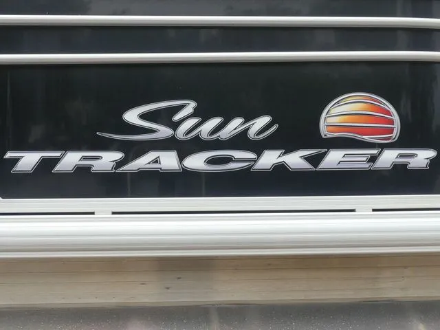 Slide: The Image of Close-up of the Sun Tracker logo on a 2020 Party Barge 22 DLX. - 13