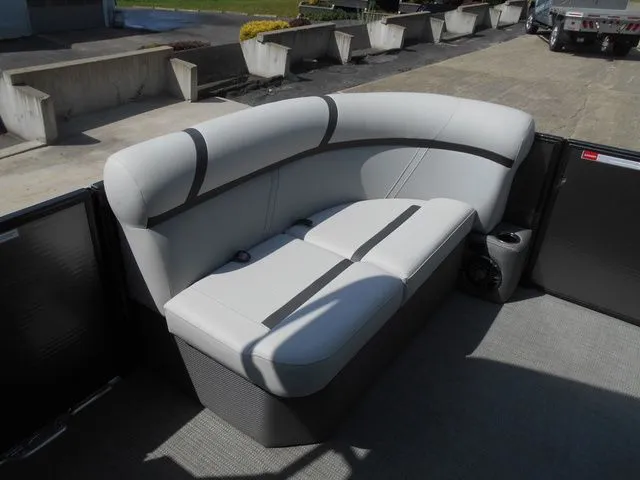 Slide: The Image of The image shows a cushioned bench seat on a boat, surrounded by gray flooring. - 8