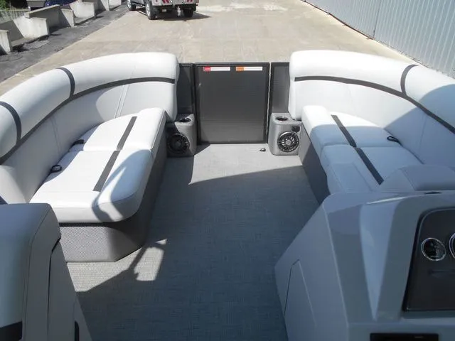 Slide: The Image of Interior of a 2024 Crest Classic LX 200 L pontoon boat with gray upholstery and speakers. - 10