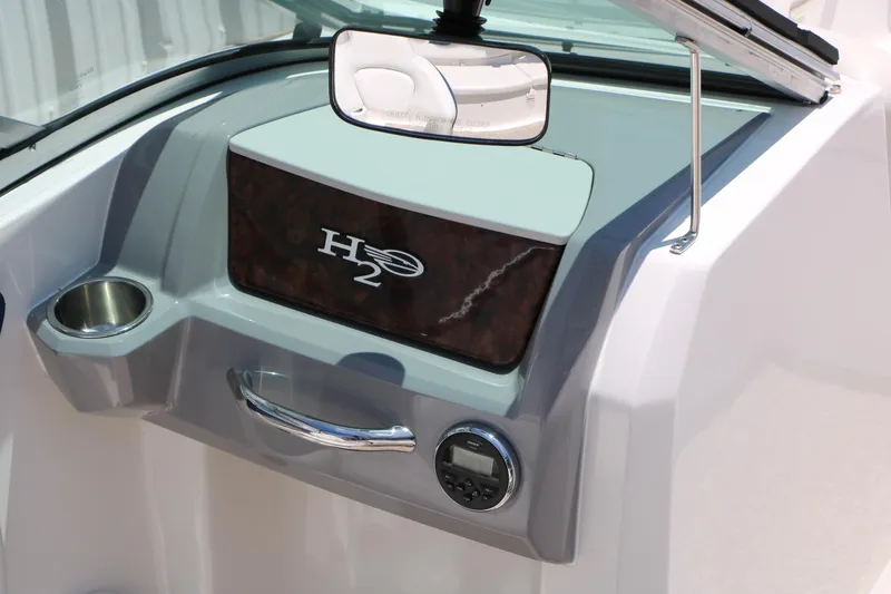 Slide: The Image of Dashboard of 2013 Chaparral 19 Sport H2O boat with cup holder and control panel. - 11