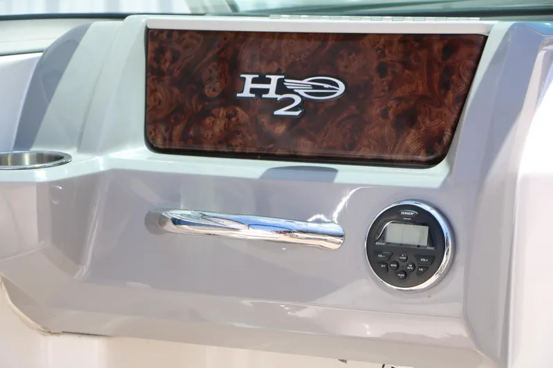 Slide: The Image of Dashboard of 2013 Chaparral 19 Sport H2O boat with H2O logo and controls. - 20