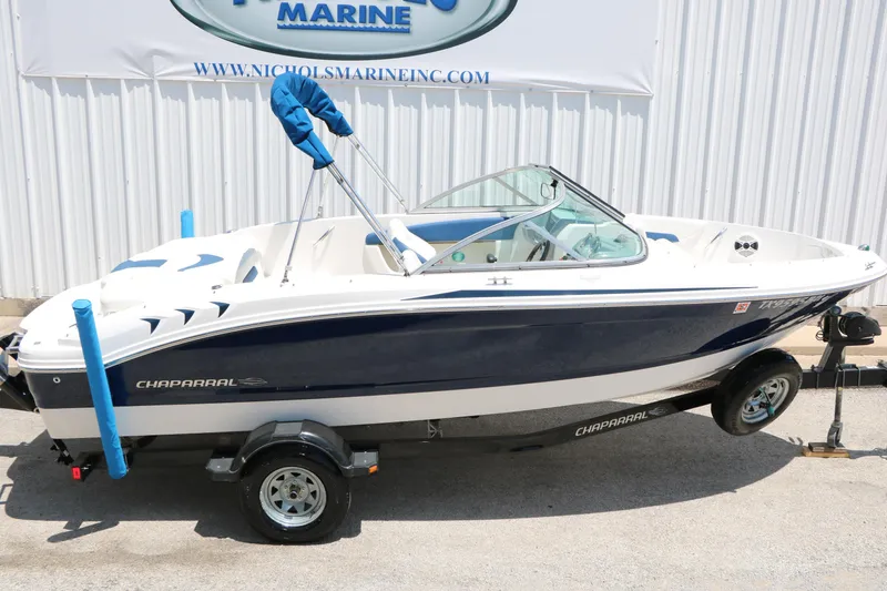 Slide: The Image of 2013 Chaparral 19 Sport H2O boat on trailer, displayed outdoors. - 41