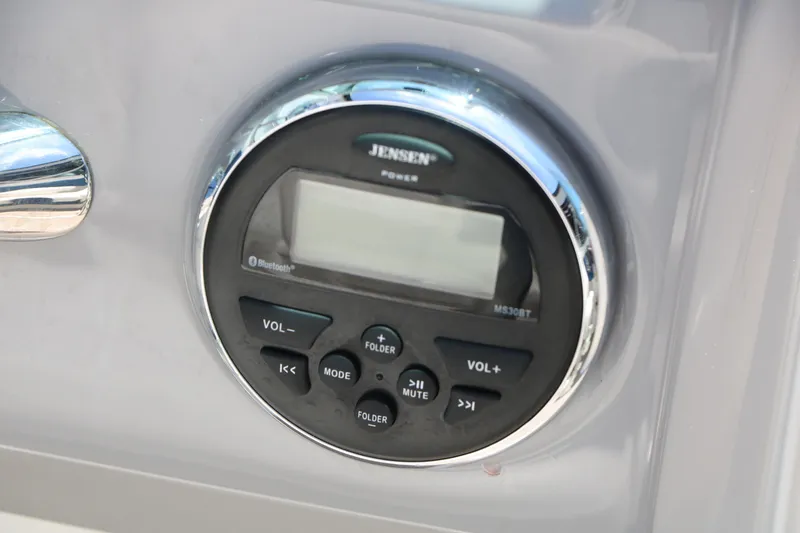 Slide: The Image of Jensen audio system on 2013 Chaparral 19 Sport H2O boat dashboard. - 30