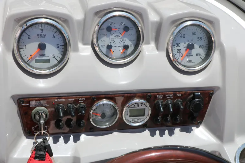Slide: The Image of Dashboard of a 2013 Chaparral 19 Sport H2O boat with gauges and controls. - 29