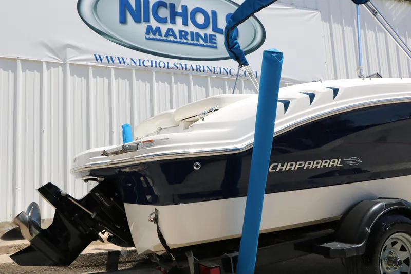 Slide: The Image of 2013 Chaparral 19 Sport H2O boat displayed at Nichols Marine dealership. - 5