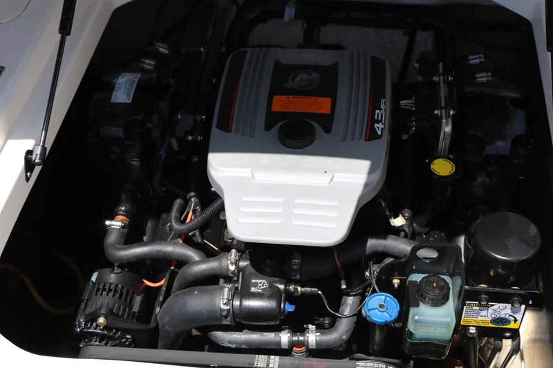 Slide: The Image of Engine compartment of 2013 Chaparral 19 Sport H2O boat, featuring 4.3 MPI engine. - 25