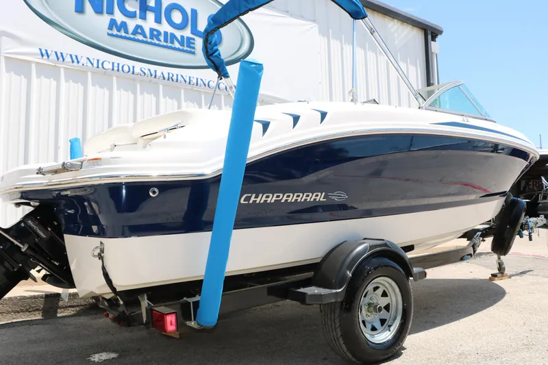 Slide: The Image of 2013 Chaparral 19 Sport H2O boat on trailer at Nichols Marine dealership. - 4