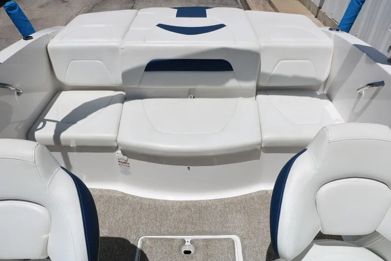 Slide: The Image of 2013 Chaparral 19 Sport H2O boat interior with white and blue seating. - 22