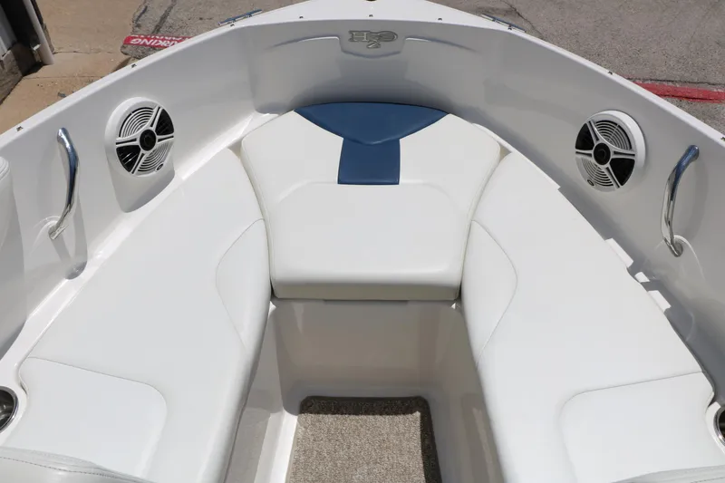Slide: The Image of Interior of 2013 Chaparral 19 Sport H2O boat with white seating and speakers. - 13