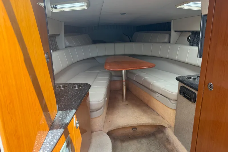 Slide: The Image of 2006 Formula 330 Sun Sport cabin interior with seating and table. - 22