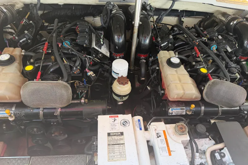 Slide: The Image of Engine compartment of a 2006 Formula 330 Sun Sport boat, showcasing dual engines and components. - 24