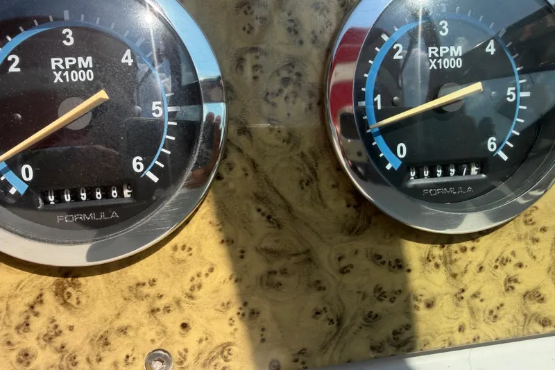 Slide: The Image of Close-up of RPM gauges on a 2006 Formula 330 Sun Sport boat dashboard. - 16