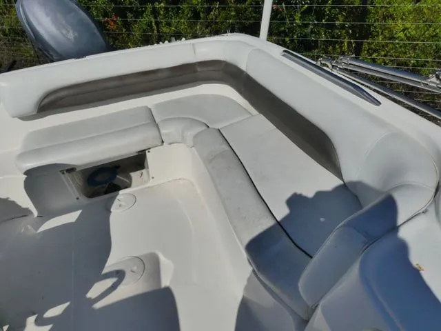 Slide: The Image of The image shows the seating area of a 2012 Hurricane Sundeck 188 boat. - 6