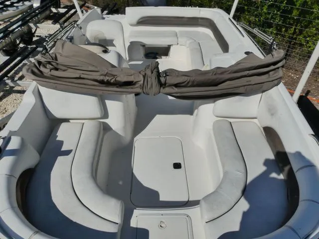 Slide: The Image of The image shows the interior of a 2012 Hurricane Sundeck 188 boat with seating areas. - 11