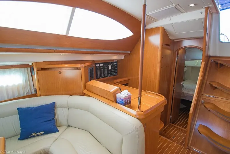 Slide: The Image of Interior of a 2006 Jeanneau Sun Odyssey 54 DS with elegant wood finish and comfortable seating. - 26