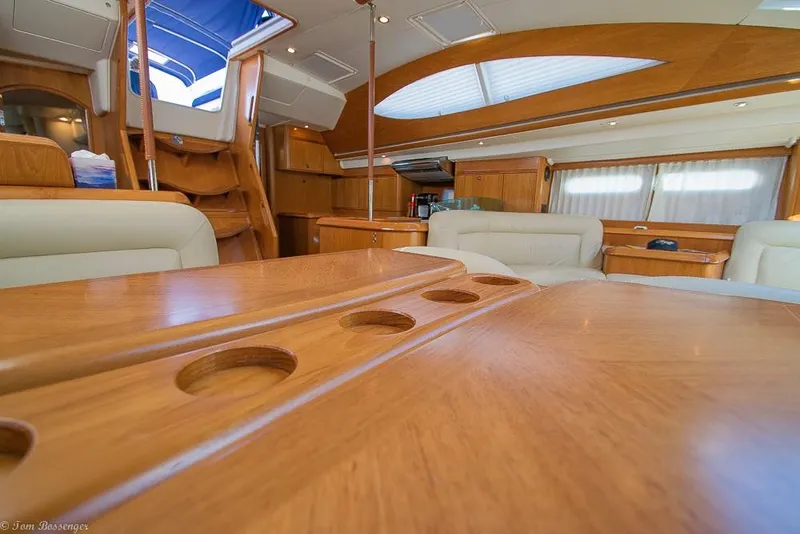 Slide: The Image of Interior of a 2006 Jeanneau Sun Odyssey 54 DS with elegant wood furnishings and comfortable seating. - 7
