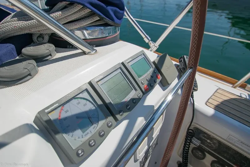 Slide: The Image of The image shows the cockpit of a 2006 Jeanneau Sun Odyssey 54 DS with navigation instruments. - 45