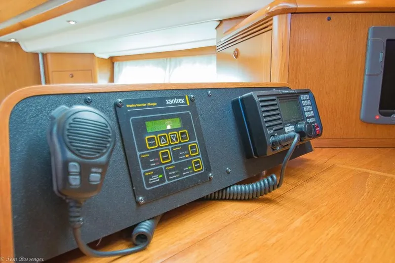 Slide: The Image of The image shows a communication panel with a radio and control unit on a wooden surface. - 28